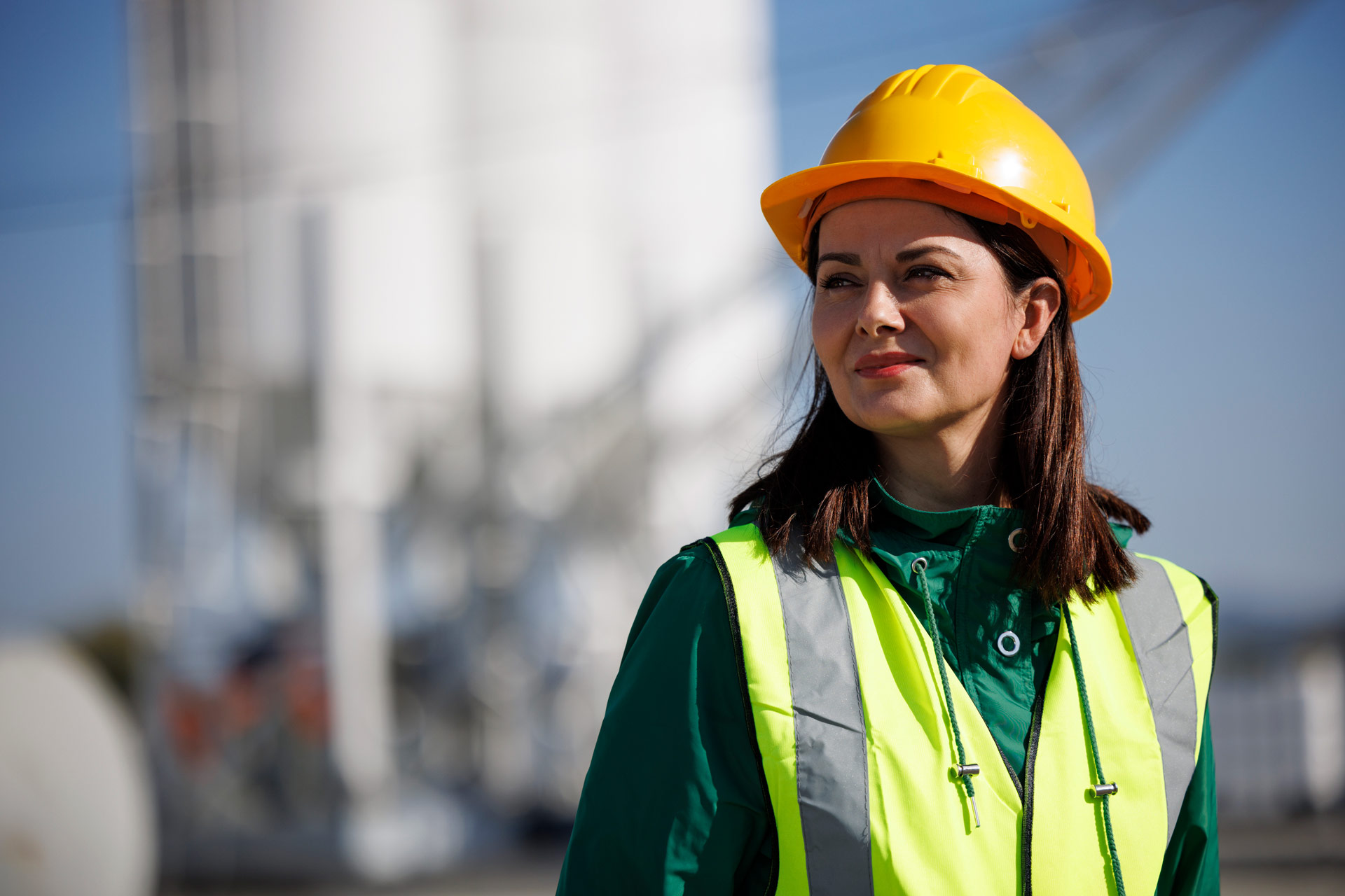 Close up of female mine worker in high viz gear and hard hat